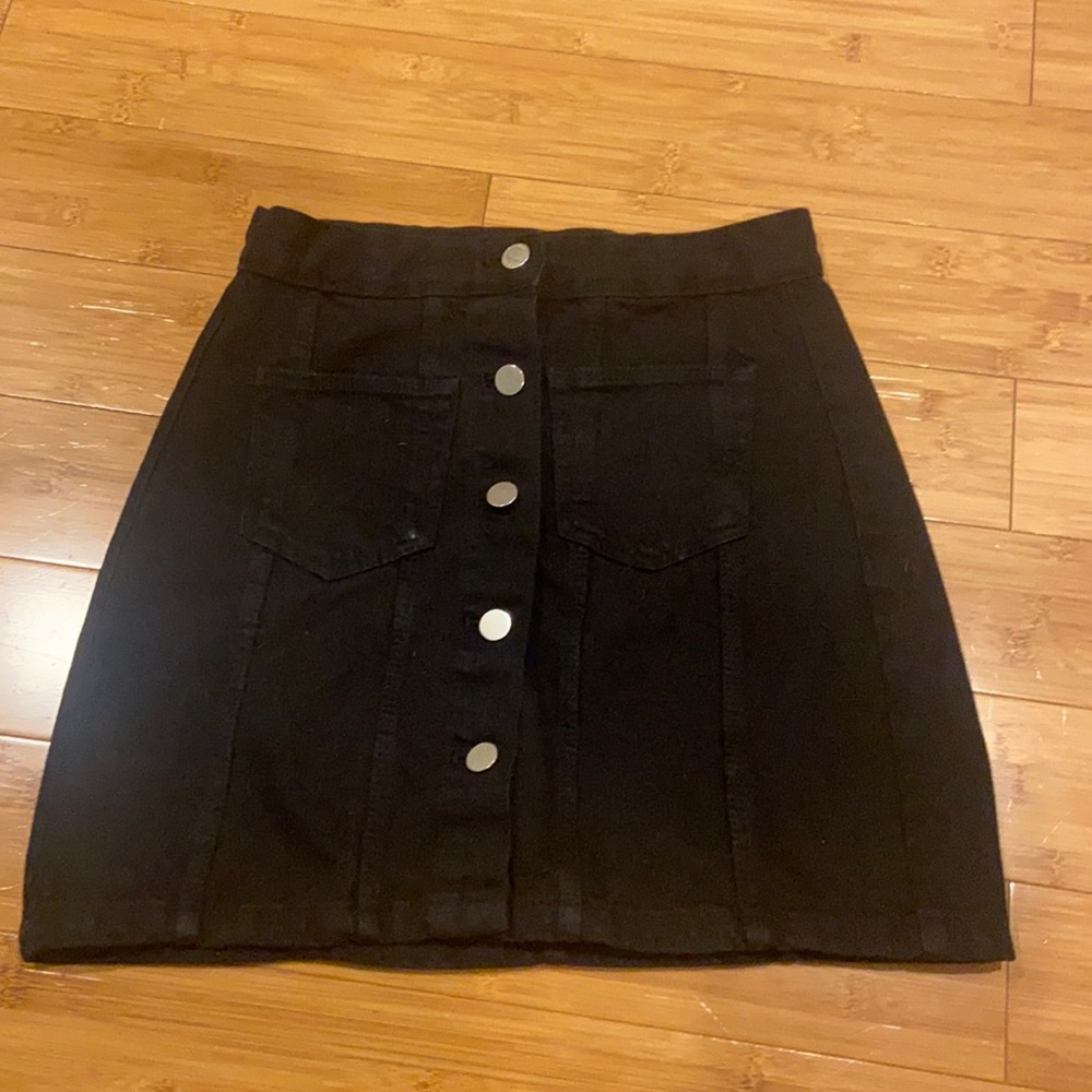 black skirt with silver buttons